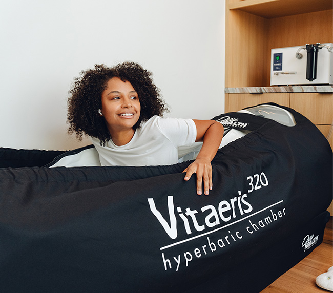 Guest relaxing inside the Vitaeris 320 hyperbaric chamber at iCRYO Richmond