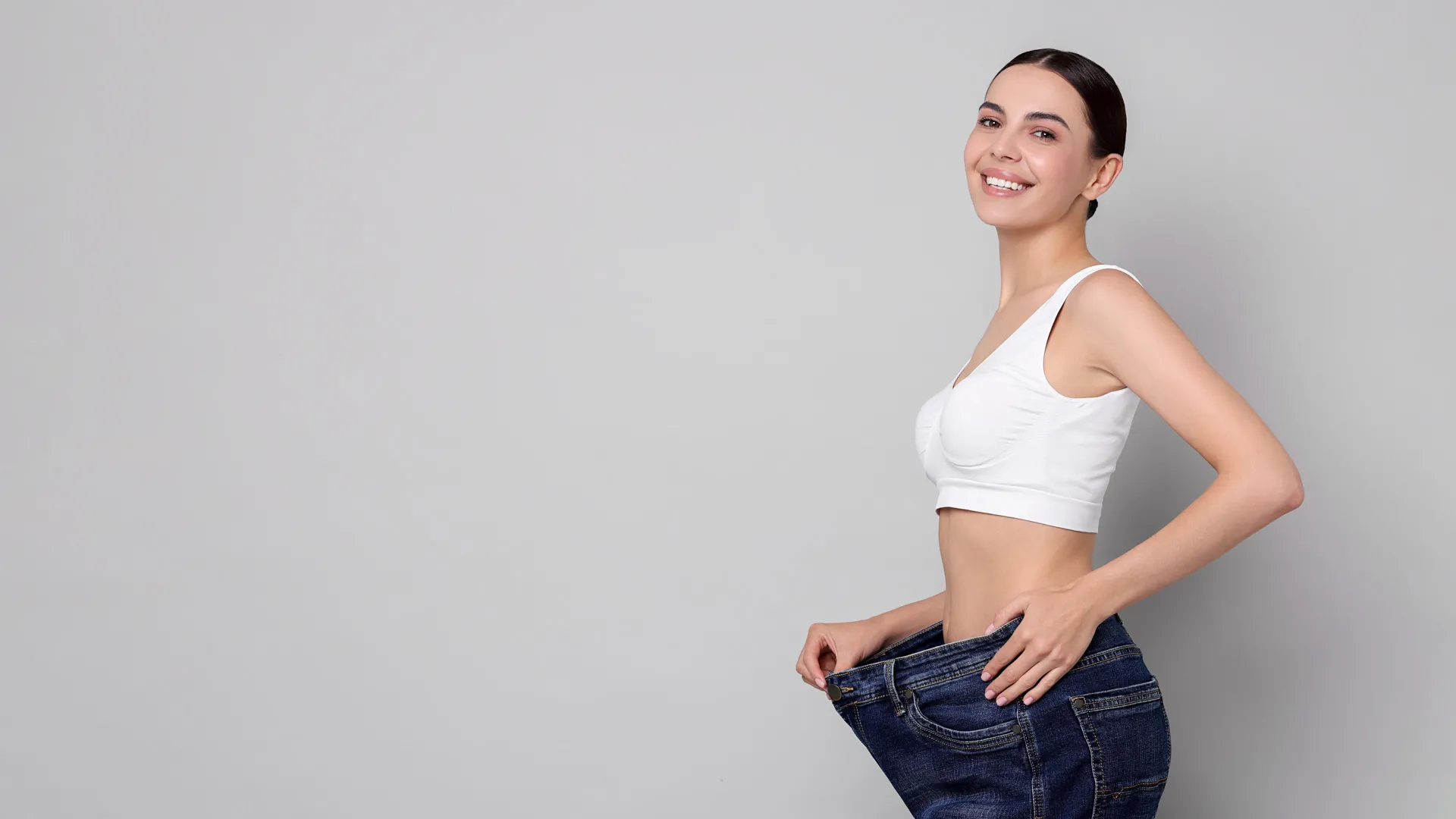 Woman celebrating weight loss results at iCRYO Richmond Medical Weight Loss program
